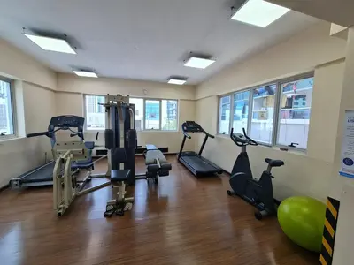 a gym with treadmills and exercise equipment in a room at Marco Polo - Find your calm escape in Dubai Marina in Dubai