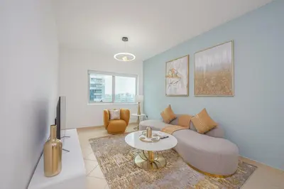 a living room with a couch and a table at Marco Polo - Find your calm escape in Dubai Marina in Dubai