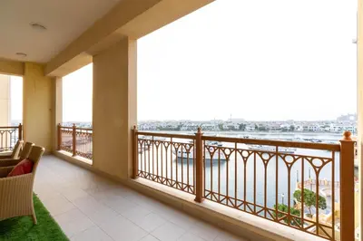 a balcony with a view of the water at Ahlan HH - Luxurious Apartment with Beach Access and Sea View at Palm Jumeirah in Dubai