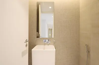 a bathroom with a sink and a mirror at Livbnb - Tranquil 2BR in Bluewaters in Dubai