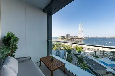 a balcony with a couch and a view of the ocean at Address JBR Sea View, Jumeirah Beach Residence, Dubai Marina - Mint Stay in Dubai