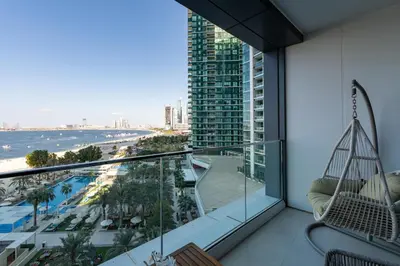 a room with a balcony with a view of the ocean at Address JBR Sea View, Jumeirah Beach Residence, Dubai Marina - Mint Stay in Dubai