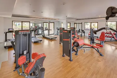 a gym with several treadmills and exercise bikes at Luxury 1BD apartment in Madinat Jumeirah Living in Dubai