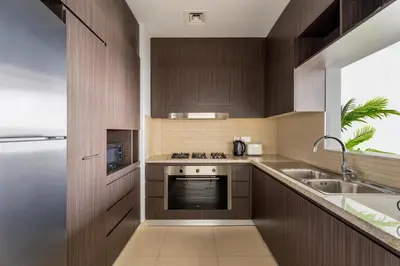 a kitchen with a sink and a stove top oven at GuestReady - Luxury Tower with Burj Khalifa View in Dubai