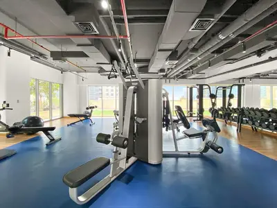 a gym with several treadmills and cardio machines at Silkhaus Burj Khalifa view large 2BDR in great location in Dubai