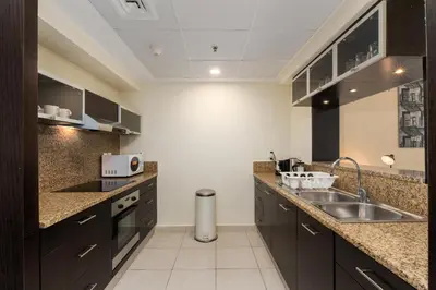 a kitchen with a sink and a counter top at Marina Quays West, Dubai Marina - Mint Stay in Dubai