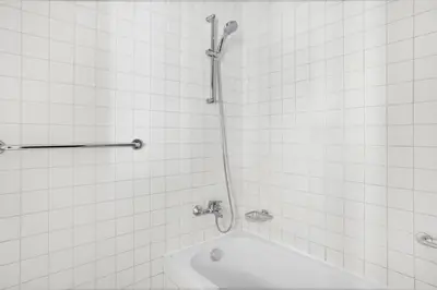a bathroom with a shower with a tub and a sink at Marina Quays West, Dubai Marina - Mint Stay in Dubai