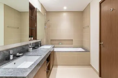 a bathroom with two sinks and a tub at GuestReady - Luxury l Sea Views Oasis in Dubai