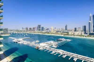 an aerial view of a marina with boats in the water at Exotic 2BR at Sunrise Bay Tower 1 Emaar Beachfront Dubai Marina by Deluxe Holiday Homes in Dubai