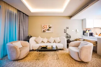 a living room with two couches and a table at FAHH Stunning 1 BHK at Address Dubai Mall in Dubai