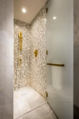 a shower with a glass door in a bathroom at FIVE Palm Jumeirah Residences - Mint Stay in Dubai