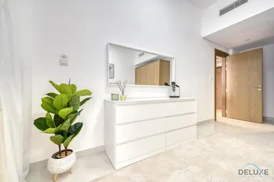 a bathroom with a mirror and a plant at Urban 1BR at Binghatti Stars Dubai Silicon Oasis by Deluxe Holiday Homes in Dubai
