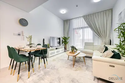 a living room with a table and chairs and a couch at Urban 1BR at Binghatti Stars Dubai Silicon Oasis by Deluxe Holiday Homes in Dubai