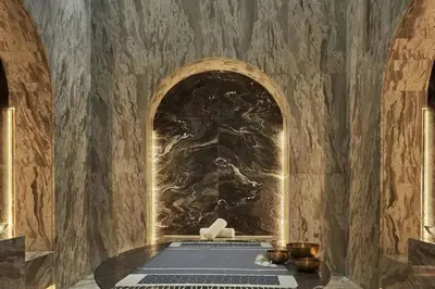 a altar in a room with a stone wall at Daniels Stunning 2BR with Full Sea View at Five in Dubai