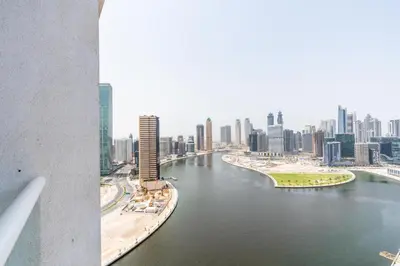 a view of a river in a city with buildings at Vacay Lettings - Damac Prive studio in Dubai