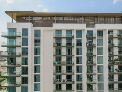 an image of a building with balconies at OYO 755 Home Sobha Greens in Dubai