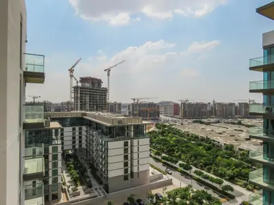 a view of a city skyline with cranes at OYO 755 Home Sobha Greens in Dubai