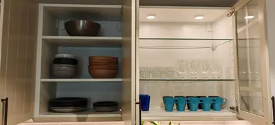 a pantry with glasses and dishes in it at La Buena Vida Holiday Homes, Luxe, 3BR with, full kitchen, Marina View, by JBR Beach, Tram & Marina in Dubai