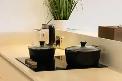 a coffee maker sitting on top of a counter at Livbnb - Upgraded 2BR, Near Shopping & Dining Hubs in Dubai