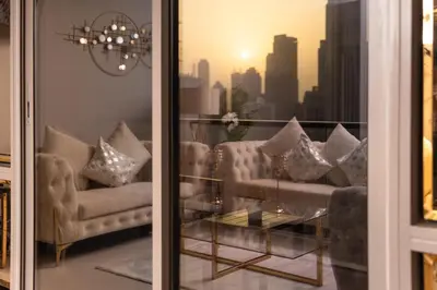 a living room with couches and a view of a city at Elite Royal Apartment - Panoramic Full Burj Khalifa, Fountain & Skyline view - Imperial - 2 bedrooms & 1 open bedroom without partition in Dubai