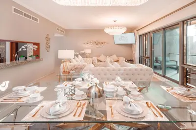 a living room with a glass table and a couch at Elite Royal Apartment - Panoramic Full Burj Khalifa, Fountain & Skyline view - Imperial - 2 bedrooms & 1 open bedroom without partition in Dubai