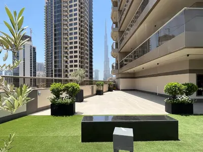 a balcony of a building with grass and plants at Trophy Elite Elegance Suites with Panaromic Burj Khalifa Views in Dubai
