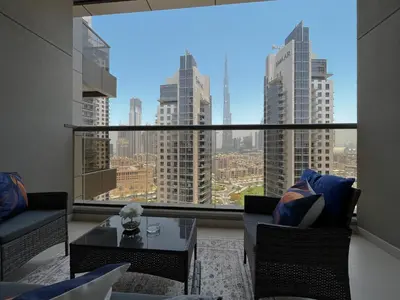 a room with a large window with a view of a city at Trophy - Sky High Haven Suite in Dubai