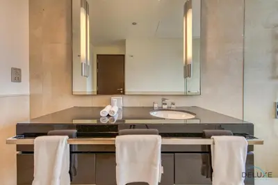 a bathroom with a sink and a counter with towels at Lush 1 BR at The Address Residences Dubai Marina by Deluxe Holiday Homes in Dubai