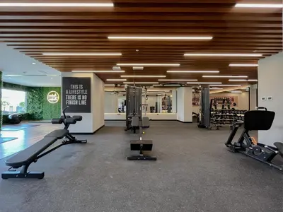 a gym with treadmills and exercise equipment in a building at Trophy Stays - Supreme Sunrise Suites w Burj Khalifa view - Studio in Dubai