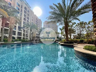 a pool at the groynes resort with a balloon in the middle at Harmony Vacation Homes - North Residence in Dubai
