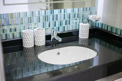 a bathroom sink with two rolls of toilet paper on it at Blue dream apartment with Harbour view in Marina in Dubai