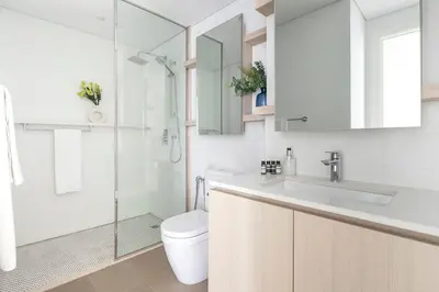 a bathroom with a toilet and a sink and a shower at Frank Porter - Belgravia 3 in Dubai
