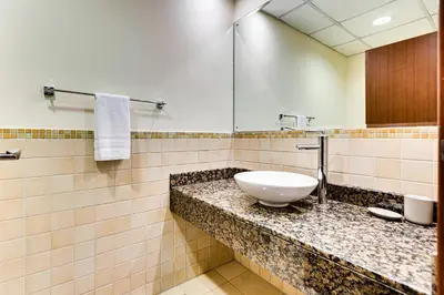 a bathroom with a sink and a mirror at Wonderful 2BD apartment near The Beach Sadaf Jbr in Dubai