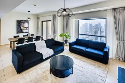 a living room with a couch and a table at Wonderful 2BD apartment near The Beach Sadaf Jbr in Dubai