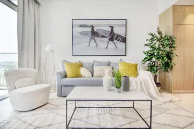 a living room with a couch and a coffee table at The Smart Concierge - Beach Vista 2 in Dubai