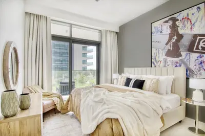 a bedroom with a large bed and a window at The Smart Concierge - Beach Vista 2 in Dubai