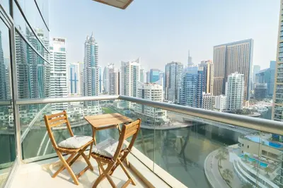 two chairs on a balcony with a view of the city at Luxury Escapes - Full Marina View Luxury 2BR - Park Island Sanibel in Dubai