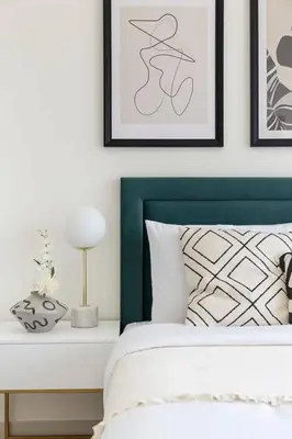 a bedroom with a bed with a green head board at Frank Porter - Park Ridge C in Dubai