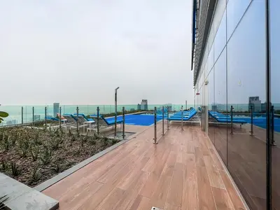 a view of the pool from the balcony of a building at Luton Vacation Homes - Damac Paramount Midtown Business Bay Dubai - 37AB09 in Dubai