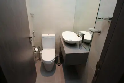 a bathroom with a toilet and a sink at AG Tower - 1BR Apartment - Allsopp&Allsopp in Dubai