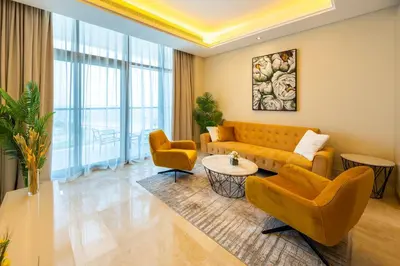 a living room with a couch and two chairs at Spacious beachfront 2 bedroom apartment - The 8 in Dubai