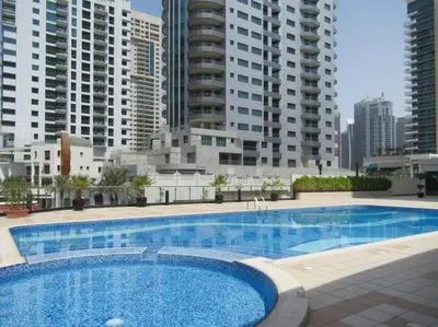 a large swimming pool in front of some tall buildings at Frank Porter - Marina Views B in Dubai