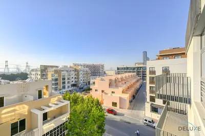 an aerial view of a city with buildings at Cheerful Studio at Belgravia Tower JVC by Deluxe Holiday homes in Dubai