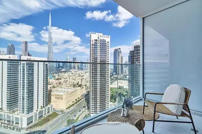 an apartment balcony with a view of a city at Luxury Studios with Burj Khalifa View or Canal view - Marquise Square Tower in Dubai