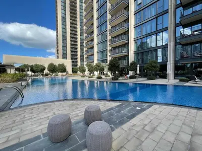 a swimming pool in the middle of a building at Silkhaus modern Boulevard 1BDR near Burj Khalifa in Downtown in Dubai