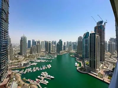 a view of a city with boats in a harbor at AWS Holiday Homes - Unique Views at Damac Heights in Dubai