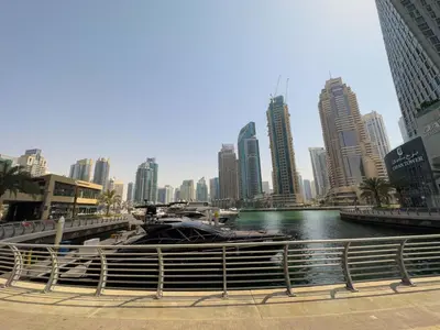 a large boat in a body of water in a city at AWS Holiday Homes - Unique Views at Damac Heights in Dubai