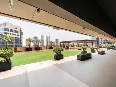 a view from the roof of a building with potted plants at Luton Vacation Homes - Elite Downtown Residence Studio, Burj Khalifa View Dubai - 80AB3 in Dubai