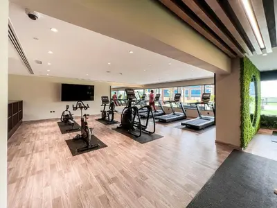 a gym with treadmills and cardio equipment in a building at Luton Vacation Homes - Elite Downtown Residence Studio, Burj Khalifa View Dubai - 80AB3 in Dubai