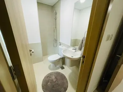 a small bathroom with a toilet and a sink at Elite Inn: Amaranta75 (Townhouse Direct pool view) in Dubai